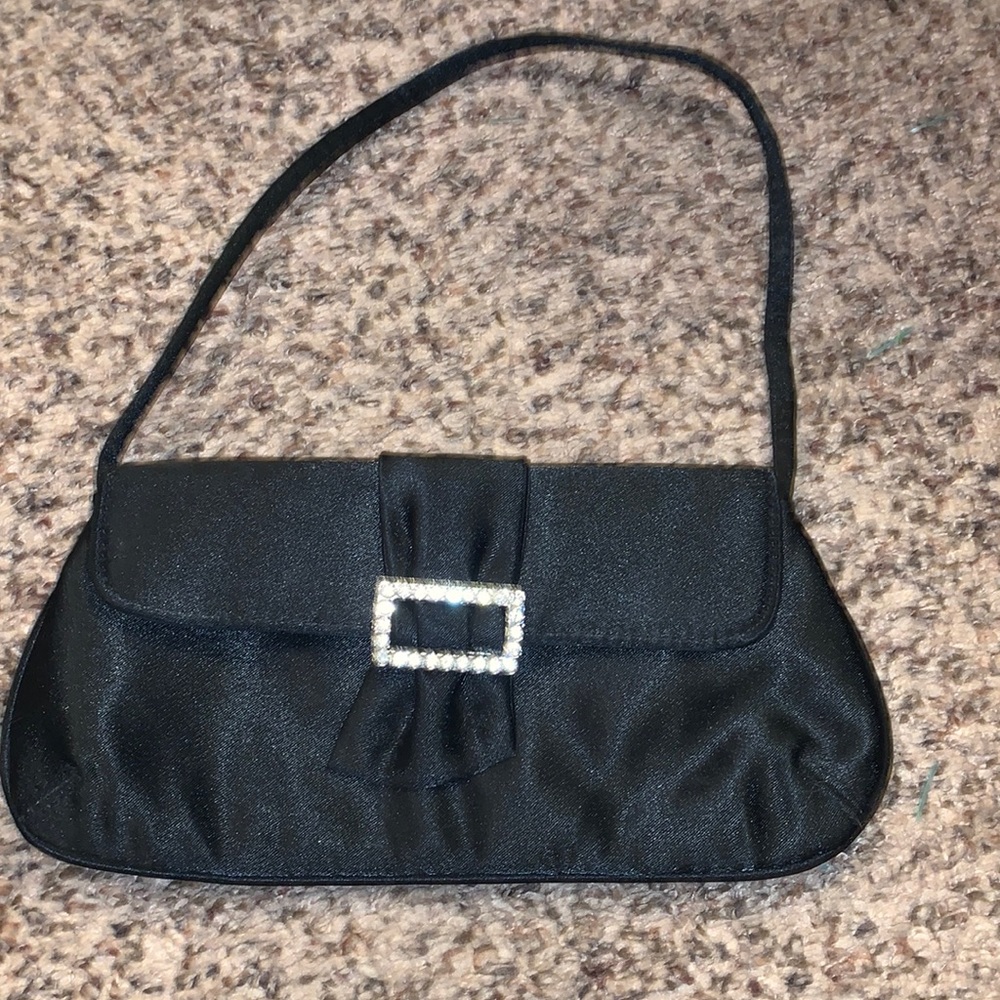 Claire’s black purse